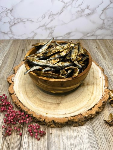 A bowl of dried sprats for dogs