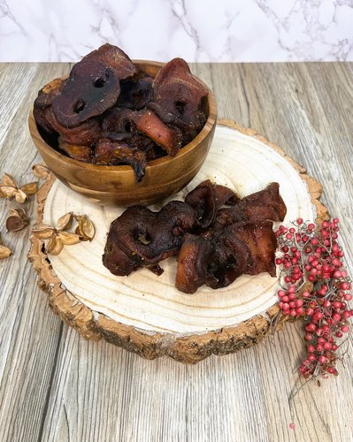 pig snout dog treats in a bowl and on a plate